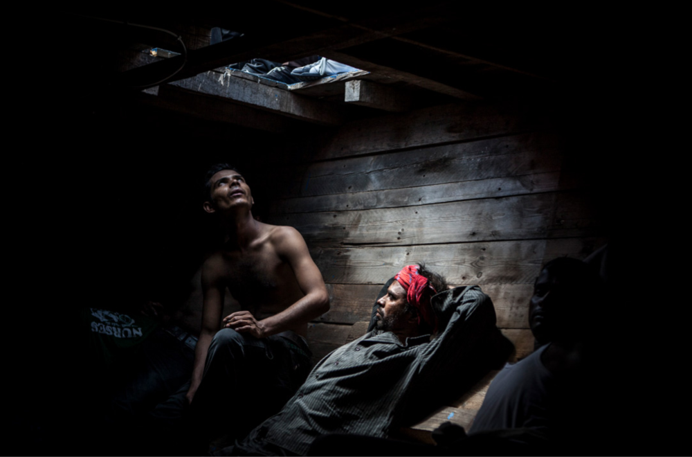 Men from Bangladesh and Pakistan have been in the cabin of a ship carrying 414 immigrants for about 12 hours. Image ©Jason Florio