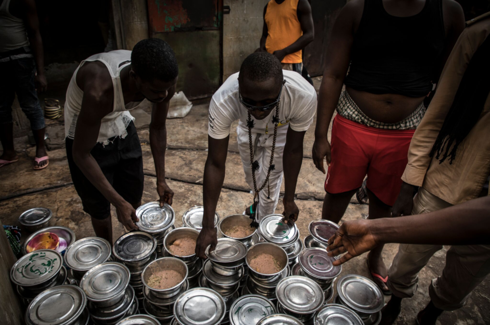 'Chop' time at Mile 2 Prison, Gambia - food made in the prison kitchen, ready to be distributed to prisoners in the remand centre block - image © Jason Florio. All rights reserved